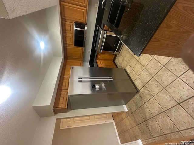 kitchen featuring decorative backsplash and appliances with stainless steel finishes