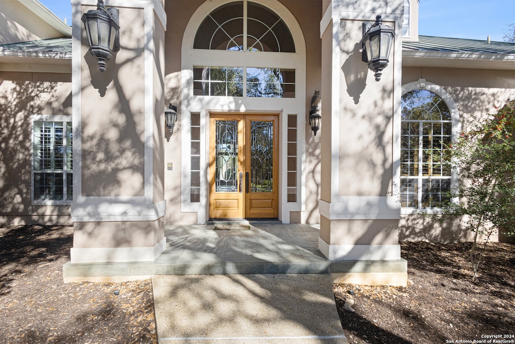 doorway to property featuring french doors