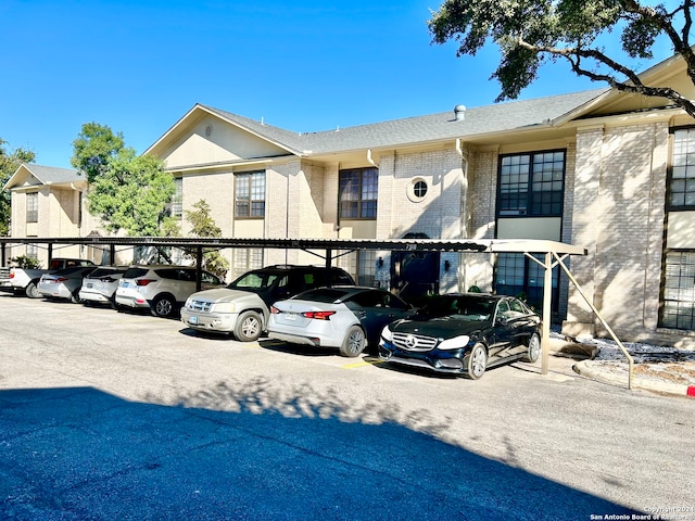 view of car parking with a carport