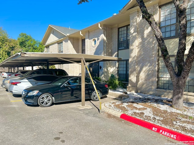 view of parking / parking lot with a carport