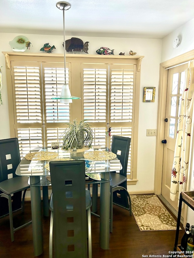 dining area featuring dark hardwood / wood-style floors