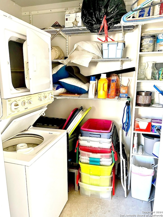 laundry area with stacked washing maching and dryer