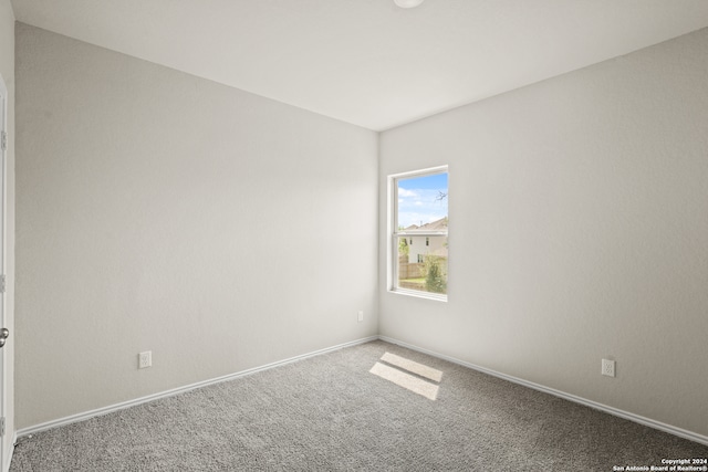 spare room featuring carpet flooring