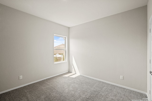 spare room featuring carpet floors