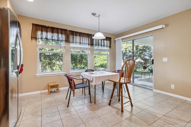 tiled dining area with plenty of natural light