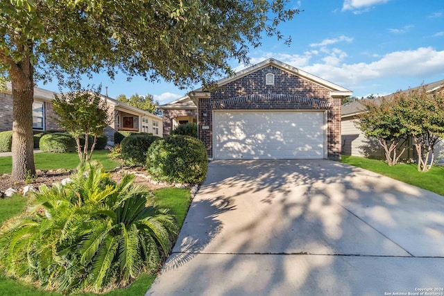 ranch-style home featuring a garage and a front lawn