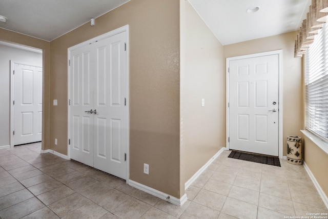 entrance foyer with light tile patterned floors