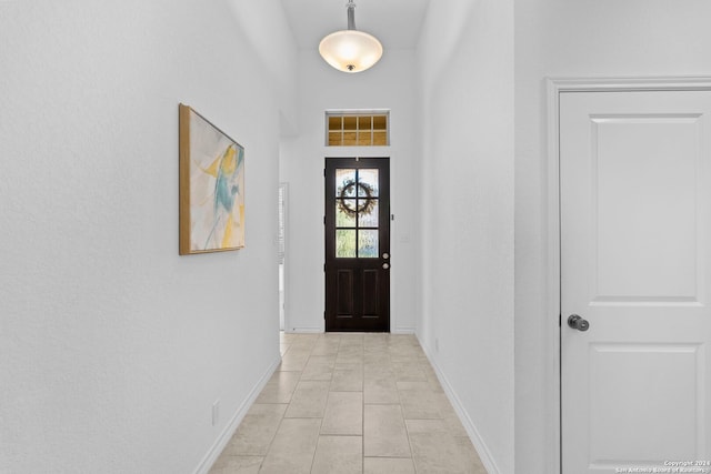 doorway to outside featuring light tile patterned floors