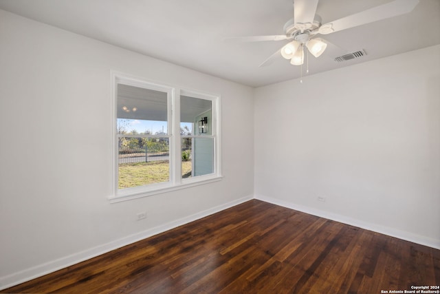 unfurnished room featuring dark hardwood / wood-style flooring and ceiling fan