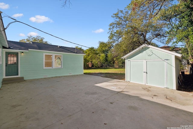 view of patio / terrace with a storage unit