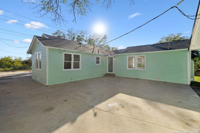 rear view of property featuring a patio area