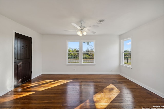 unfurnished room featuring dark hardwood / wood-style floors and ceiling fan