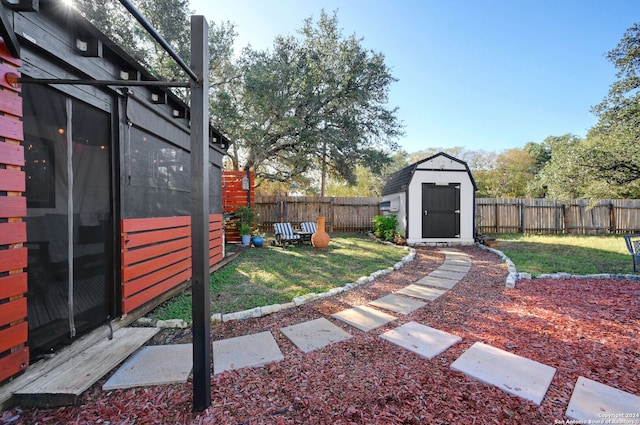 view of yard featuring a storage unit