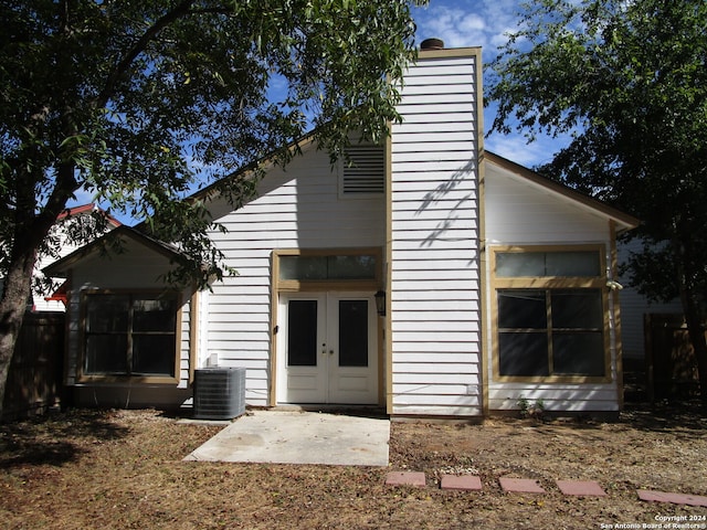 view of front of home featuring french doors, a patio, and central AC unit