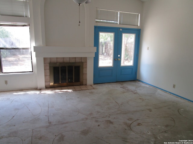 foyer entrance featuring a fireplace and french doors