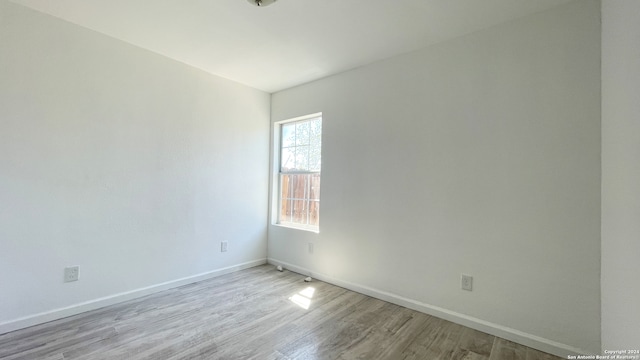 spare room featuring light wood-type flooring