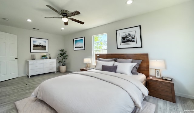 bedroom featuring ceiling fan and light wood-type flooring