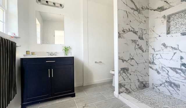 bathroom featuring tiled shower, radiator heating unit, vanity, and toilet