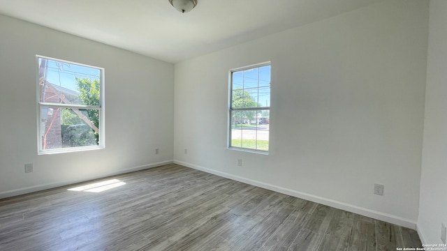 spare room with hardwood / wood-style flooring