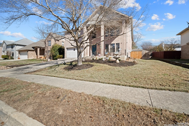 view of front of house featuring a garage and a front yard