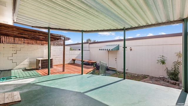 view of patio / terrace featuring cooling unit and a wooden deck