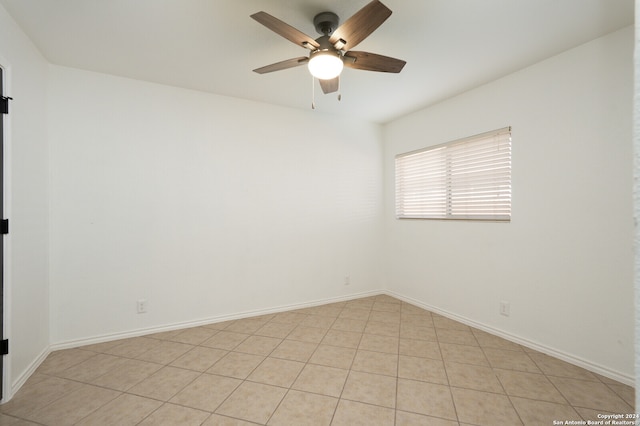 tiled empty room with ceiling fan