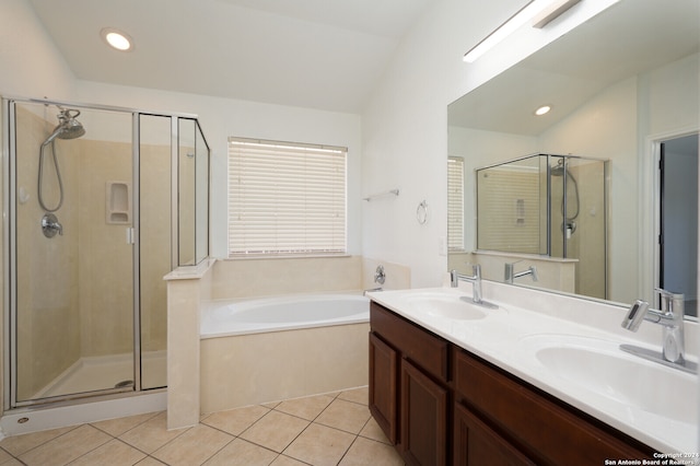 bathroom with tile patterned floors, vanity, independent shower and bath, and lofted ceiling