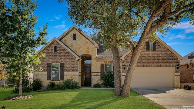 view of front of property with a front lawn and a garage