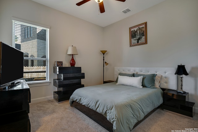 carpeted bedroom featuring ceiling fan