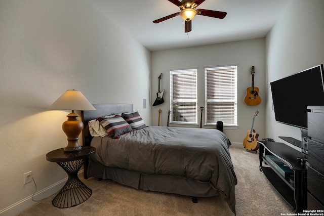 bedroom with light carpet and ceiling fan