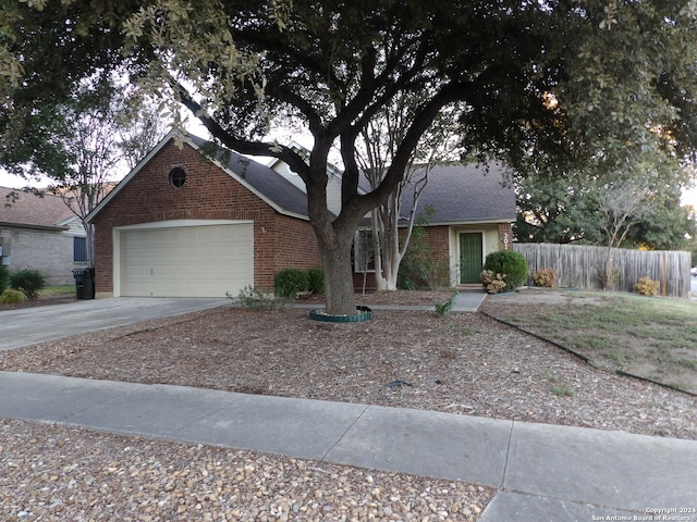 ranch-style house featuring a garage