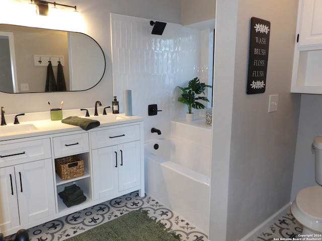 bathroom with tile patterned floors, vanity, toilet, and a bathtub