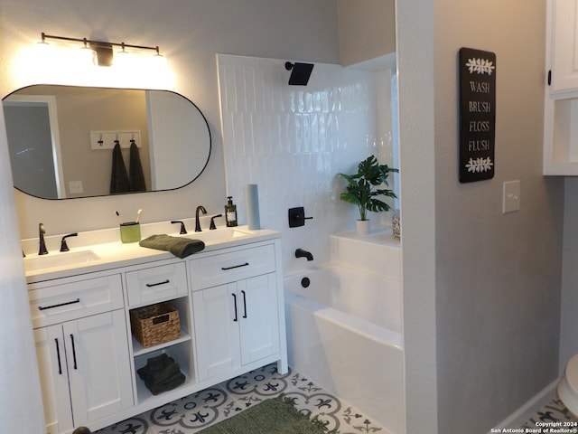 bathroom featuring a washtub, vanity, and tile patterned floors