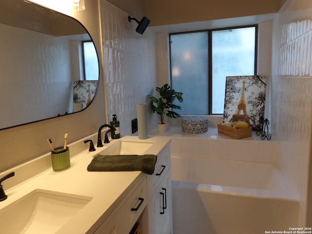 bathroom with a bathing tub and vanity