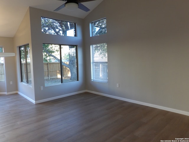 spare room with ceiling fan, hardwood / wood-style floors, and high vaulted ceiling