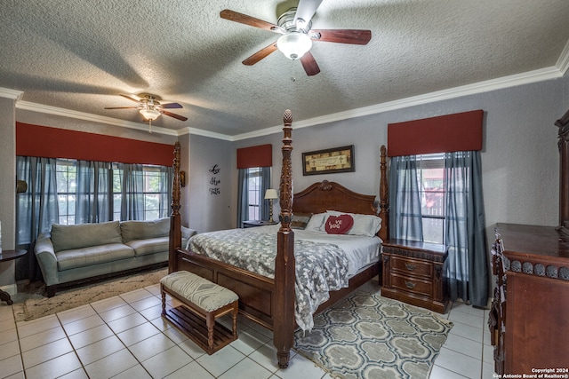 tiled bedroom with multiple windows, ceiling fan, and a textured ceiling