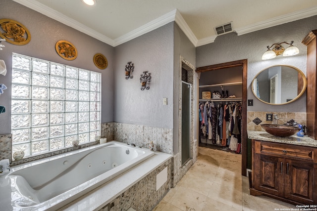 bathroom with tile patterned floors, vanity, independent shower and bath, and ornamental molding