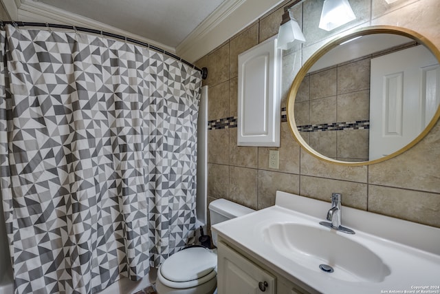 bathroom featuring vanity, toilet, tile walls, and ornamental molding