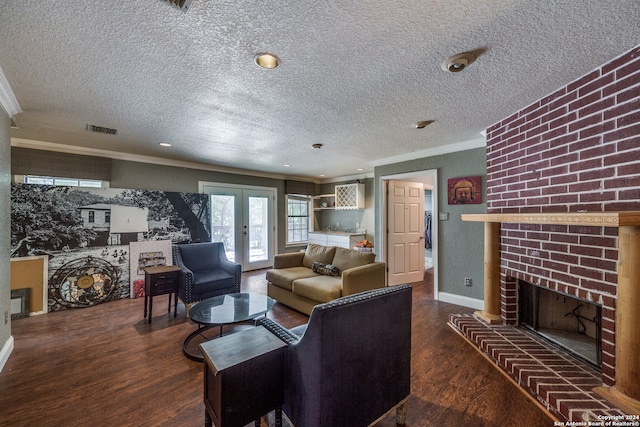 living room with a fireplace, french doors, a textured ceiling, and dark wood-type flooring