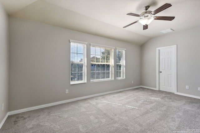 unfurnished room with light carpet, ceiling fan, and lofted ceiling