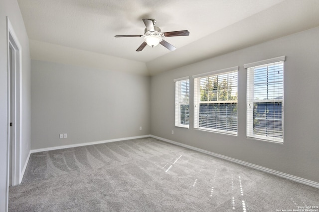 spare room featuring ceiling fan and light colored carpet