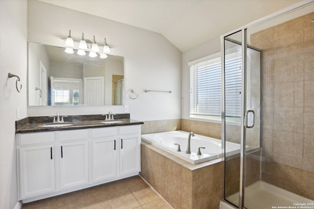 bathroom featuring plus walk in shower, tile patterned floors, vanity, and vaulted ceiling