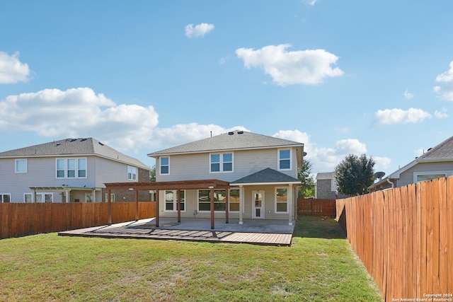 back of house with a yard and a patio area