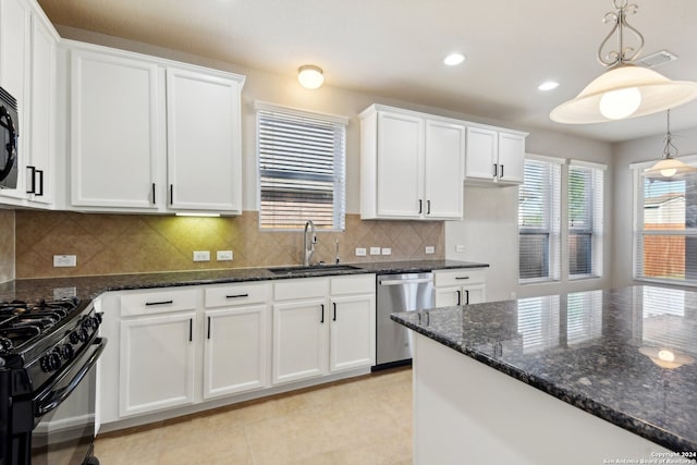 kitchen featuring white cabinets, stainless steel dishwasher, sink, and hanging light fixtures