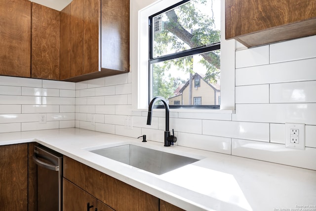 kitchen with tasteful backsplash and sink