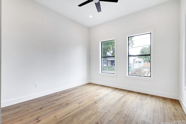 empty room featuring ceiling fan and light hardwood / wood-style floors