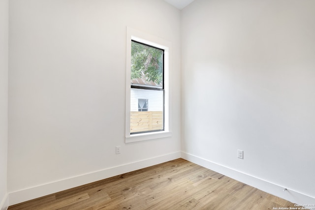 empty room with light hardwood / wood-style floors