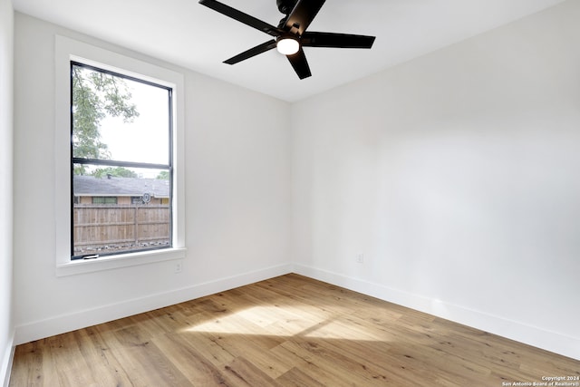 spare room with ceiling fan and hardwood / wood-style floors