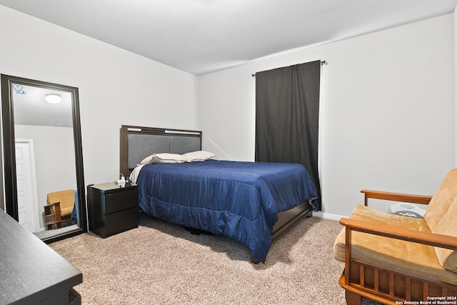 bedroom with light carpet