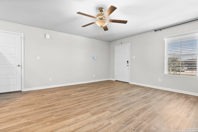 spare room with ceiling fan and light hardwood / wood-style floors